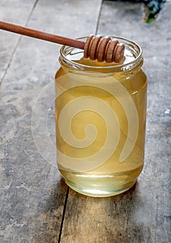 Glass honey jar with dipper