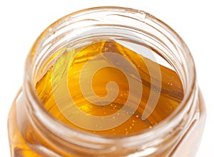 glass honey jar isolated on white background