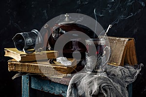 A glass of hot black tea in a vintage cup holder. Wonderful still life. Selective focus. The glass is opposite the window