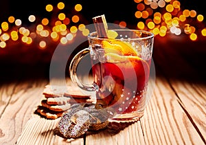Glass of hot spicy Gluhwein with cookies photo