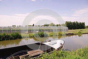 Glass house with a canal in front