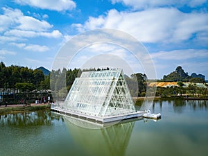 Glass house triangle church by the lake