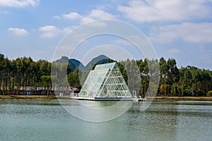 Glass house triangle church by the lake