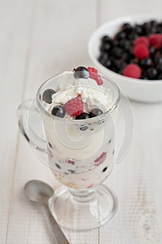 Glass with ice cream and fresh berry