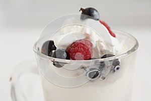 Glass with ice cream and fresh berry