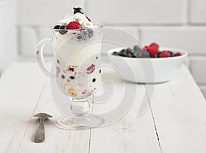 Glass with ice cream and fresh berry