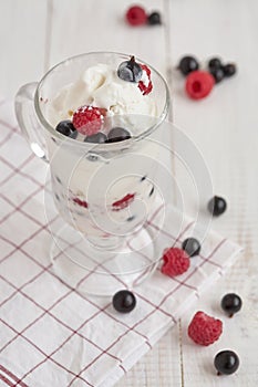 Glass with ice cream and fresh berry