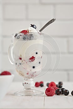 Glass with ice cream and fresh berry