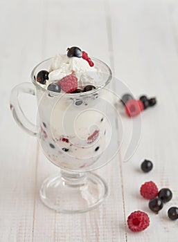 Glass with ice cream and fresh berry