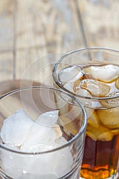 Glass with ice cubes and cola