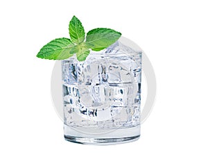 Glass of ice cubes cold water with fresh mint leaves for drink in summer