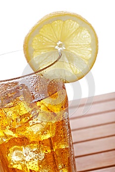 Glass of ice tea with lemon