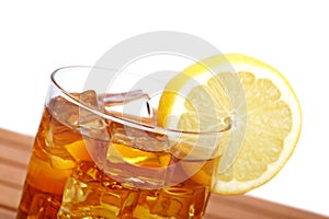 Glass of ice tea with lemon