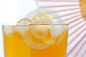 Glass of ice tea with lemon