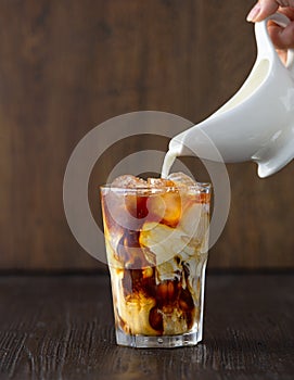 Glass of iced coffee with milk