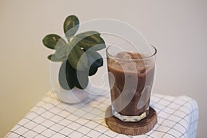 A glass of iced milk cocoa