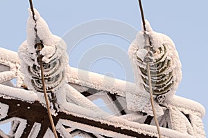 Glass insulator on the power line. Insulator of electrical high-voltage lines