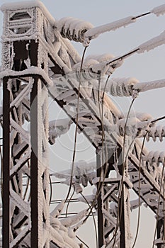 Glass insulator on the power line. Insulator of electrical high-voltage lines