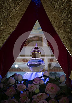 Glass jar of Buddha`s relics at Wat Nong Waeng. photo