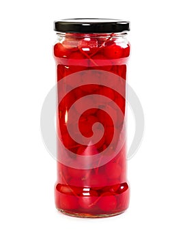 Glass jar with canned cocktail cherry
