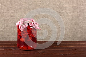 Glass jar with canned fruits