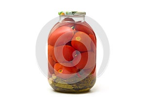 Glass jar of canned tomatoes with seasoning on white background