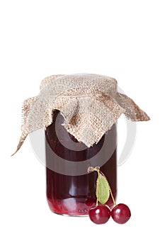 Glass jar with cherry jam