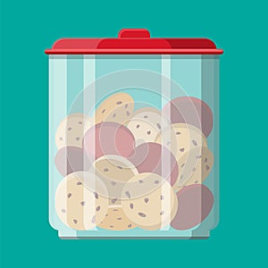 Glass jar with choclate cookies inside.
