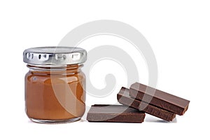 Glass jar with chocolate spred and three pieces photo