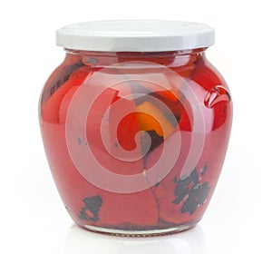 Glass jar with conserved red paprika photo