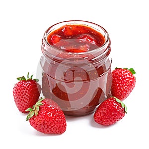 Glass jar with delicious strawberry jam on white background