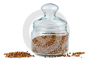 Glass jar with dried buckwheat seeds