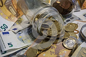 Glass jar of euro coins