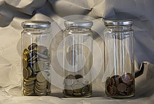 Glass jar of euro coins