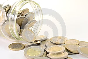 Glass jar with euro coins