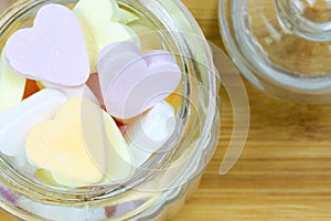 Glass jar filled with heart candies