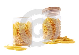 Glass jar filled with penne pasta isolated