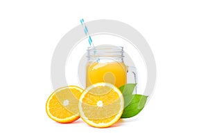 Glass jar with fresh orange juice and tubule, oranges with leaves isolated on white background