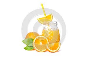 Glass jar with fresh orange juice and tubule, oranges with leaves isolated on white background