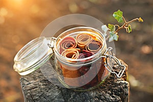 Glass jar with fruit pastille rolls