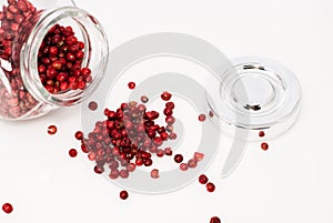 Glass jar full of red pepper seeds