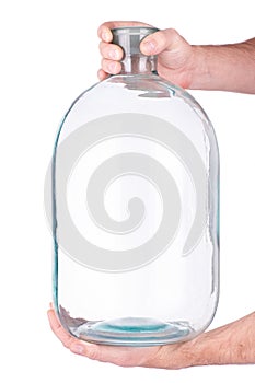 Glass jar in hand on white background