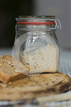 Glass jar with homemade sourdough starter for rye bread