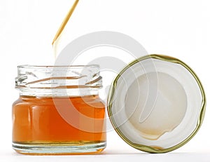 Glass jar of honey