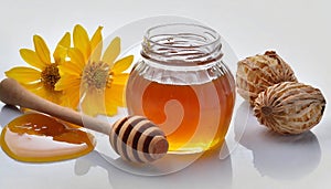 Glass jar of honey, flowers and wooden dipper with spaced grooves isolated on white background