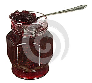 Glass jar of jam and spoon