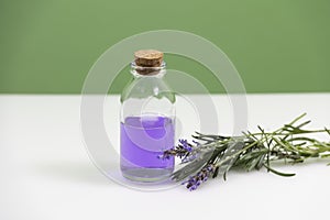 Glass jar with lavender essential oil