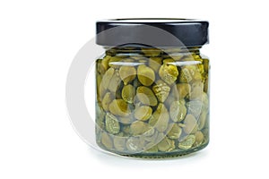 Glass jar with marinated capers isolated