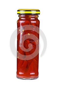 Glass jar with marinated red chili peppers