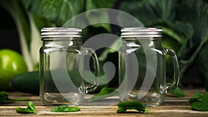 Glass jar. Mason Jar for drinking. Empty glass jar with lid and handle good for smoothie. Green Vegetables and fruits Ingredients